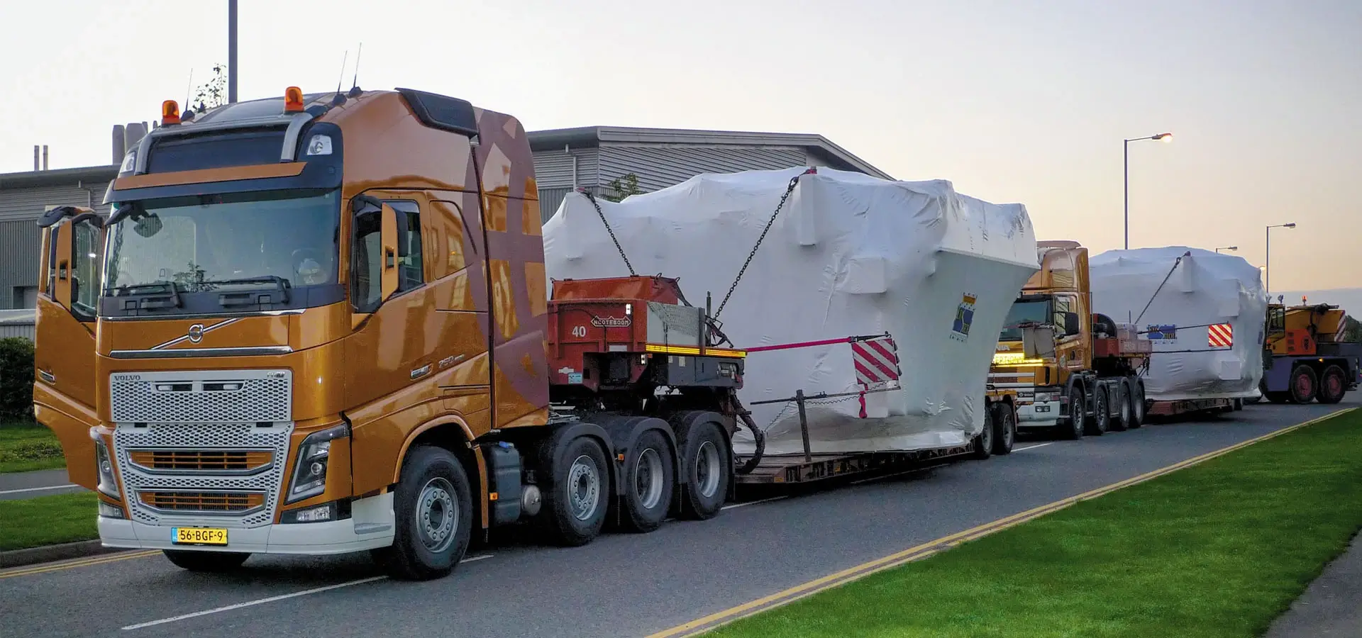 SLS_Slider_1920x900_2-copy HGVs carrying large loads down a road