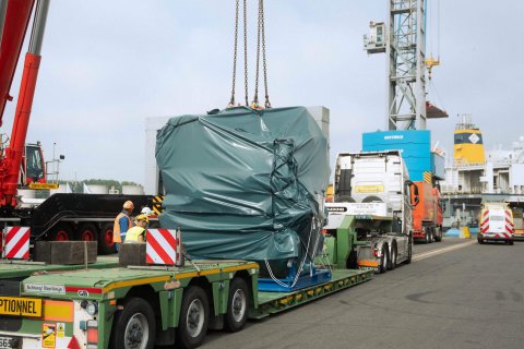 Excavator being transported on a heavy‑haulage trailer